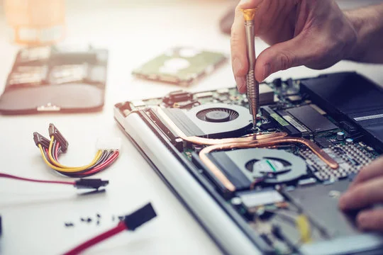 Technician repairing smartphone